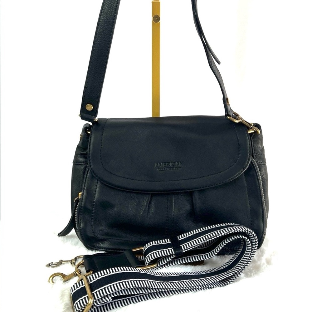 American leather co crossbody bag with flap closure.
